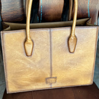Back of briefcase, showing smooth distressed light brown leather