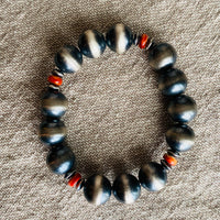 Sterling silver ranch pearls with red beads on linen background