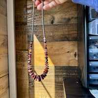 22 Inch graduated deep purple spiny and sterling silver pearls