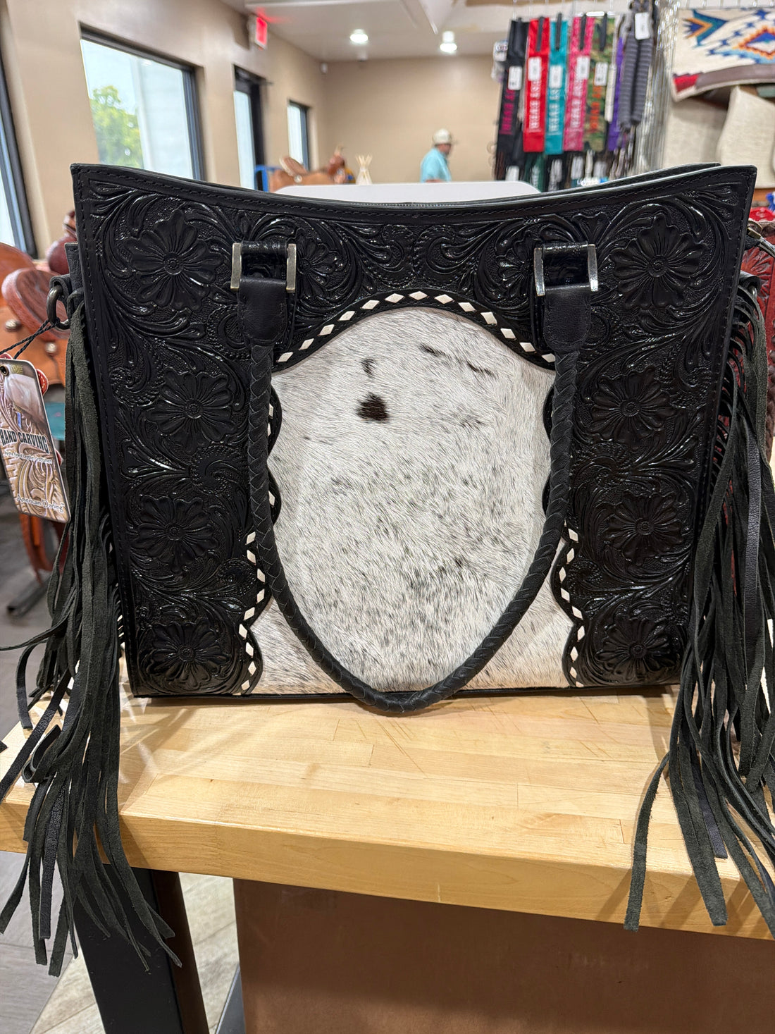 Black tooled fringe purse with braided handles