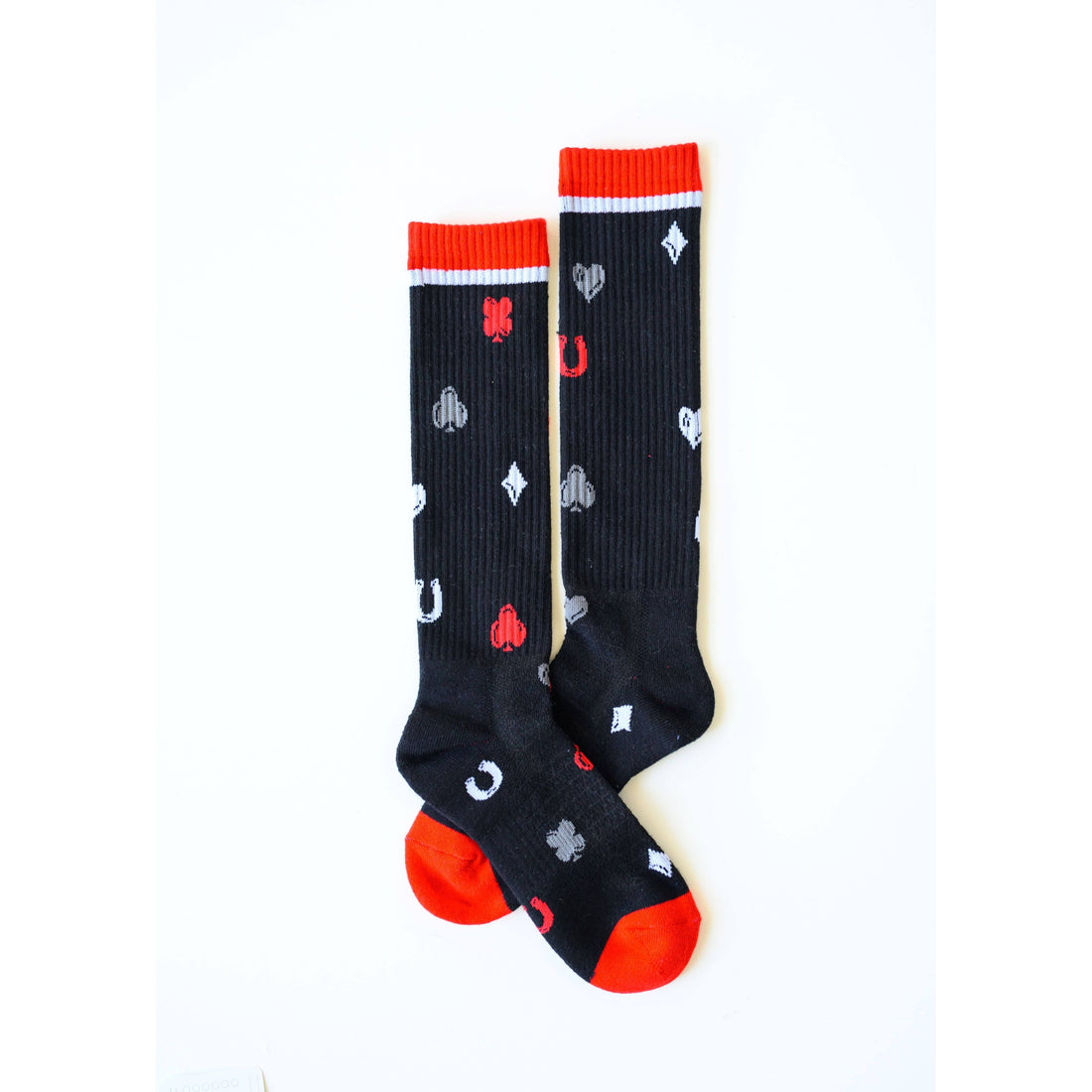 pair of blacks socks with card suits and horse shoes in white, grey and red